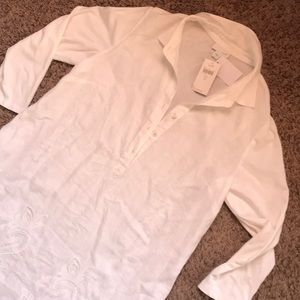 White shirt dress with detailing.